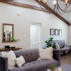 Inviting Foyer and Living Area With Exposed Beam Ceilings