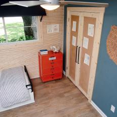 Corkboard Closet Doors, Red Tool Chest Dresser and Skinnylap Wall Treatment in Boy's Bedroom 