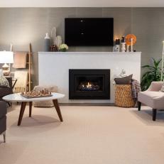 Structured White Fireplace Surround, Mantel Mounted Television and Neutral Furniture in Midcentury Modern Living Room