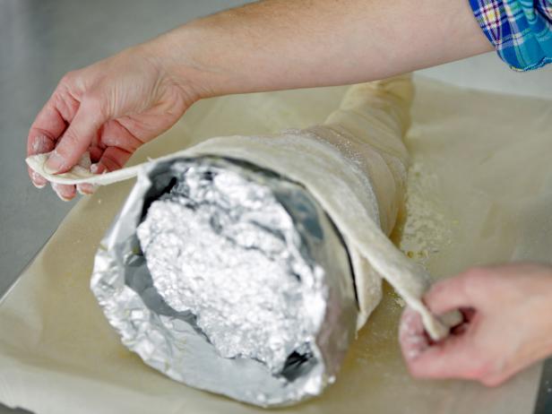 Use strips of bread dough and aluminum foil to create an edible centerpiece for your Thanksgiving or fall table.
