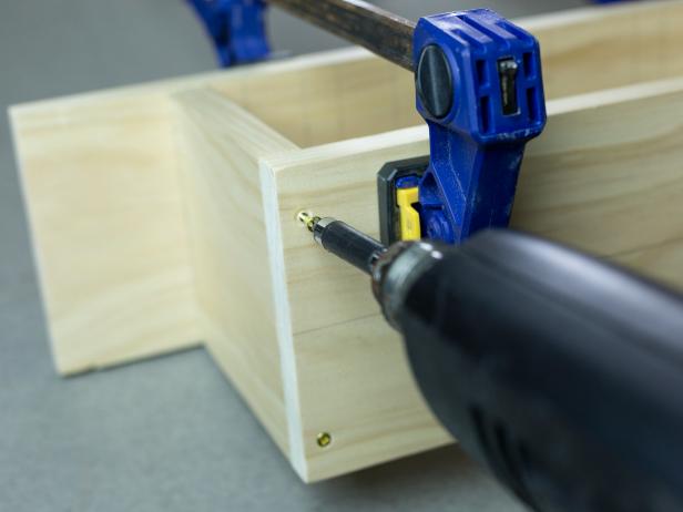 Create a wall mounted tape dispenser