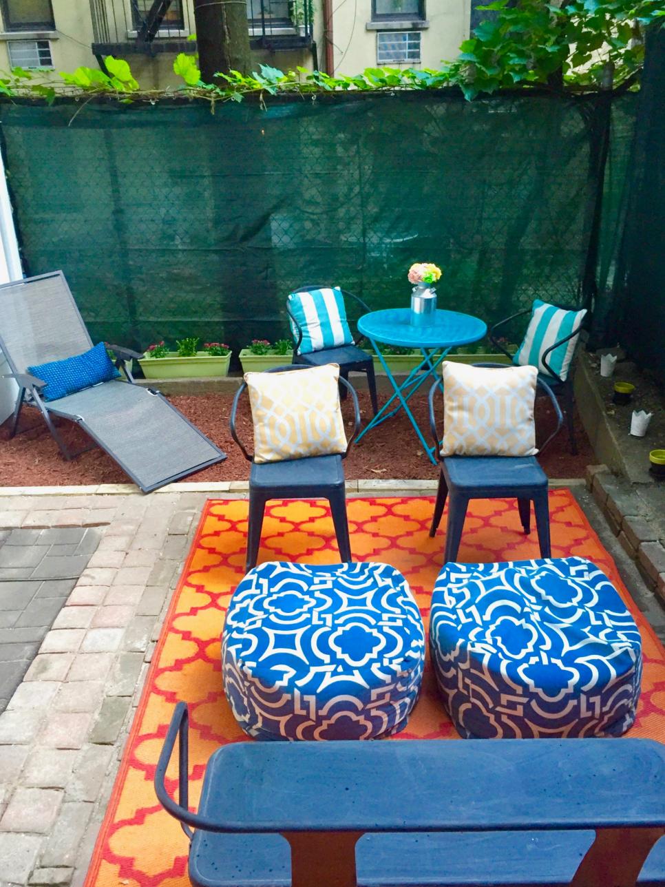Urban Patio With Green Mesh Privacy Screen and Vibrant Fabrics Mesh Privacy Screen