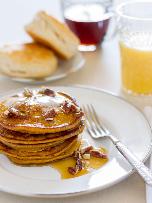 Pumpkin Spice Pancakes Covered With Syrup and Pecans Pumpkin Spice Pancakes Covered With Syrup and Pecans