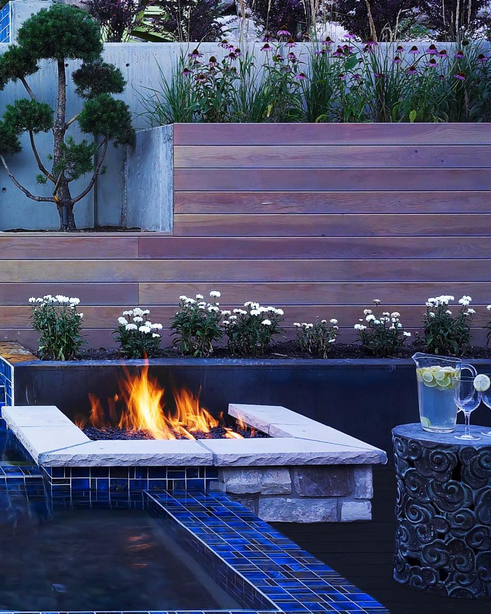 Modern Stone Fire Pit and Tiered Wooden Planters Modern Stone Fire Pit and Tiered Wooden Planters