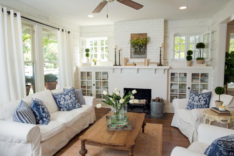 White Slipcovered Furniture and Blue Throw Pillows in Living Room
