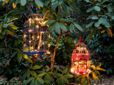 Give your deck or patio a welcoming, exotic vibe with these 
DIY birdcage lanterns painted in vibrant hues and outfitted with 
convenient remote controlled LED lights.