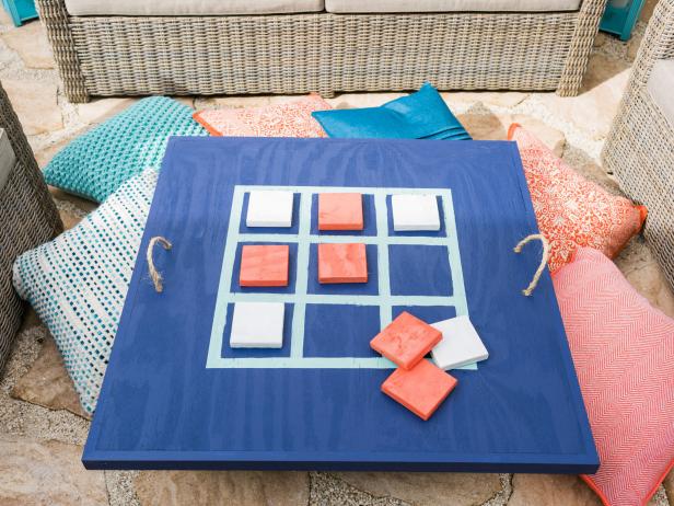 Not sure what to do with your fire pit now that itâs warming up outside? Repurpose it with this colorful DIY game top you can make in a couple of hours.