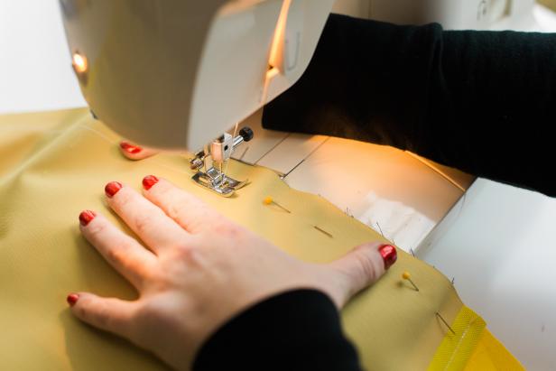 Leaving a 1-inch inseam, sew the three raw edges together. Trim excess material, then turn the pillow case inside out and iron