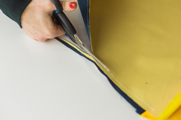 Leaving a 1-inch inseam, sew the three raw edges together. Trim excess material, then turn the pillow case inside out and iron