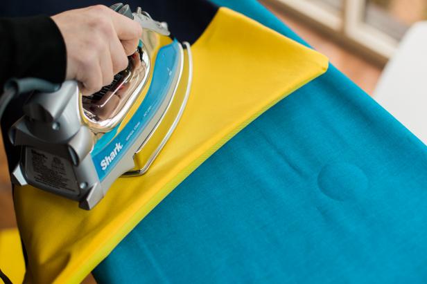 Leaving a 1-inch inseam, sew the three raw edges together. Trim excess material, then turn the pillow case inside out and iron