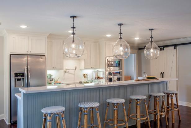 Bright Blue and White Kitchen With White Barn Doors, Large Island and Wicker Bar Stools Bright Blue and White Kitchen With White Barn Doors, Large Island and Wicker Bar Stools