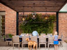 Steel Pergola with Dining Table and and Hanging Light Pendants 