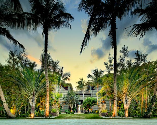 Front View of Home With Tropical Landscaping Front View of Home With Tropical Landscaping