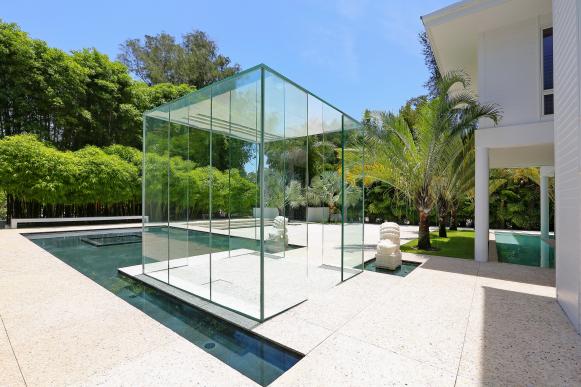 Outdoor Space with Water Features and Glass Cube Structure