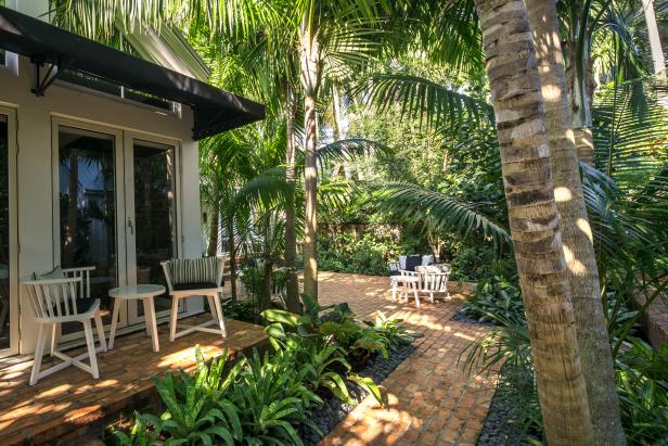 Brick Patio and Walkways With White Chairs Brick Patio and Walkways With White Chairs