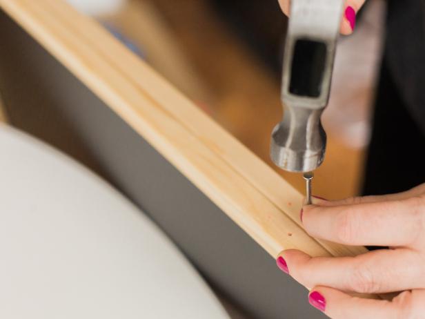 Make a hole using a hammer and nail on these marks.