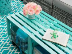 Vibrant color, plentiful storage and casual style make this DIY outdoor coffee table perfect for almost any decor.