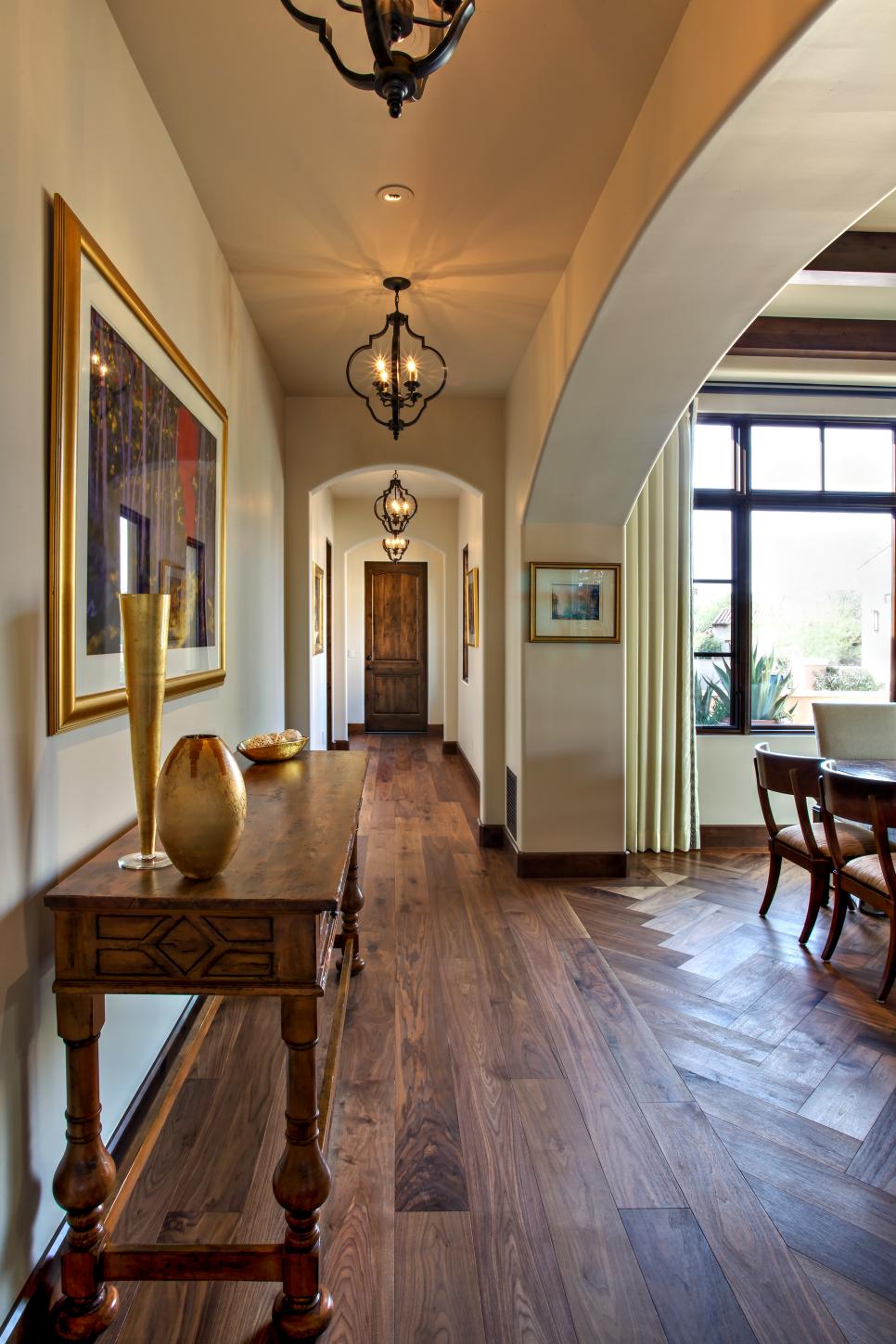 Mediterranean Hallway With Bronze Pendant Lights Neutral Hallway With Bronze Pendant Lights and Large Archways