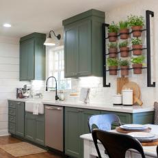 Country Kitchen With Indoor Herb Garden, Sage Green Cabinets, and White Shiplap Walls 