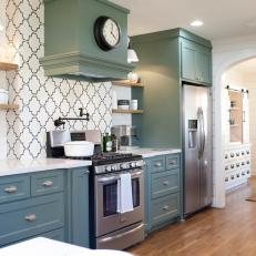 Country Kitchen With Sage Green Cabinetry, Patterned Tile Backsplash and Hardwood Flooring 