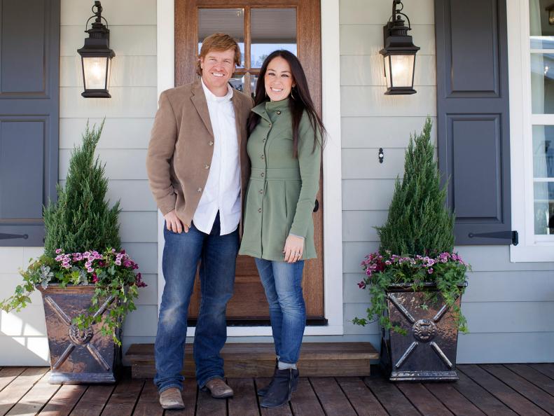 Chip and Joanna Gaines outside the Ward's newly remodeled house, as seen on Fixer Upper. (After)