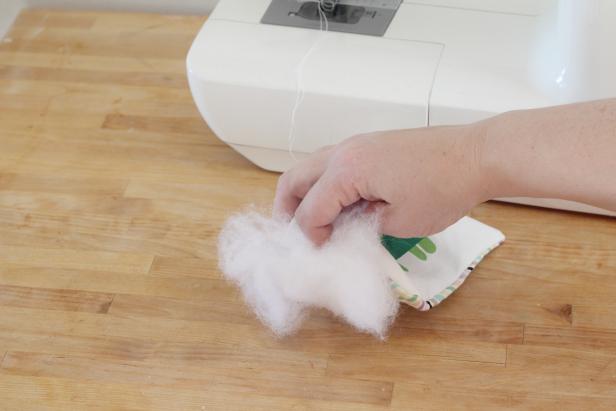 Step 6: Turn the rattle right side out. Fill with poly fill and a few jingle bells.