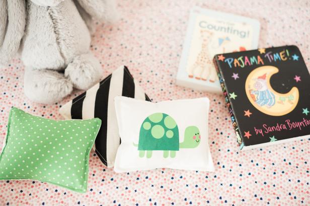Give the new parents a set of one-of-a-kind baby rattles to celebrate their bundle of joy. Babies love contrasting colors, soft textures, and fun rattle sounds. These DIY sewn baby rattles have all three of those elements plus the addition of cute animal photos.