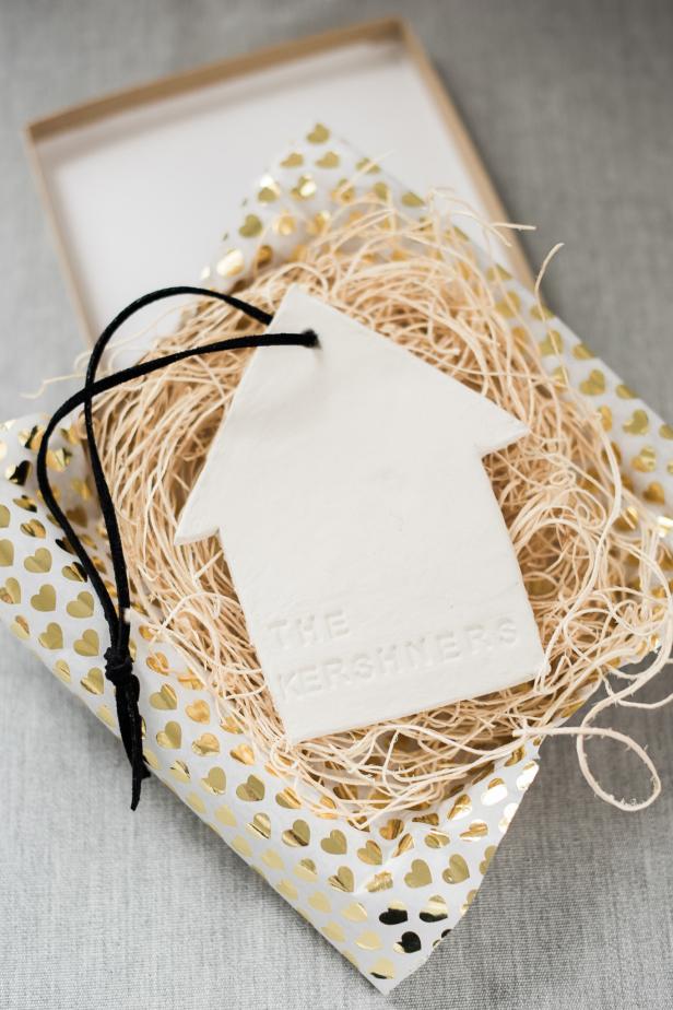 A new home to create happy memories in is a milestone worth celebrating. Create a DIY keepsake ornament with the familyâs name for them to treasure for years to come.