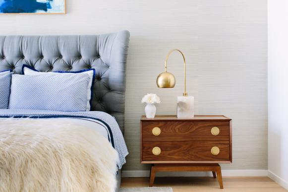 Gray Upholstered Headboard and Small Nightstand in Eclectic Bedroom Arc Lamp on Nightstand in Eclectic Bedroom