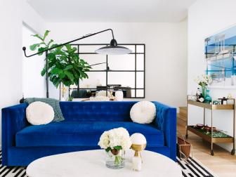 White Coffee Table and Blue Sofa in Eclectic Living Room