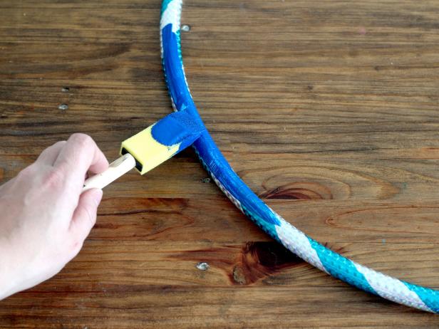 Paint the hula hoop to match the color of the sheet.
