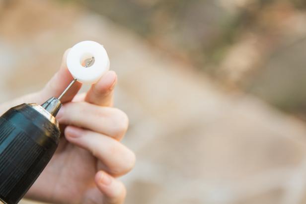 Using the 1/16” drill bit, pre-drill into each of the 12 plastic grommets. Then, drill into that same hole using the countersink bit, so that when you do add the screws later, the screws will lay flush against the side of the grommet.