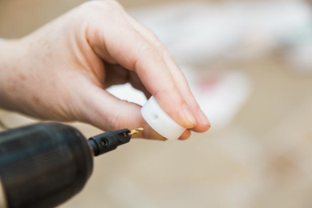 Using the 1/16” drill bit, pre-drill into each of the 12 plastic grommets. Then, drill into that same hole using the countersink bit, so that when you do add the screws later, the screws will lay flush against the side of the grommet.