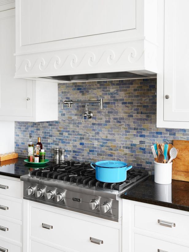 Cooktop in White Kitchen With Blue Backsplash Cooktop in White Kitchen With Blue Backsplash