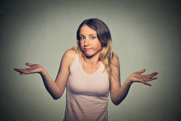 woman arms out shrugs shoulders who cares so what woman arms out shrugs shoulders who cares so what