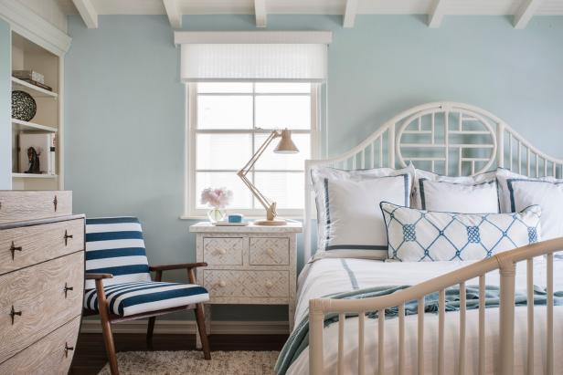 Pastel Blue Walls in Cottage Bedroom With White Bed With Blue Linen Accents, Blue and White Striped Chair and Light Wood Furniture Pastel Blue Walls in Cottage Bedroom With White Bed With Blue Linen Accents, Blue and White Striped Chair and Light Wood Furniture