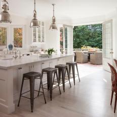 Metal Pendant Lights and Barstools, Long Eat-In Island and Patio Access French Doors in Bright Transitional Kitchen 