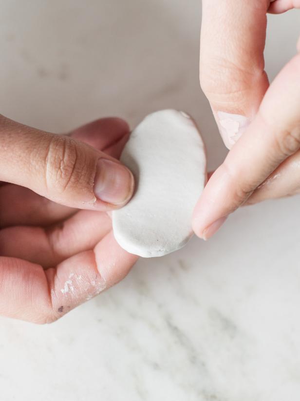 Step 2: Cut ClayUse a wooden clay knife (or kitchen knife) and cut clay in desired shape. Smooth out rough edges by wetting a finger with water and running it along the edge.