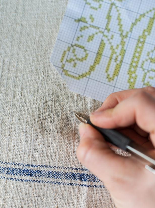 Step 1: Select Monogram PatternCross-stitch patterns can be purchased online or from a craft store, but many can also be found online for free. Position monogram pattern over tea towel to make sure the size and design will achieve the desired look. Pattern can be lightly sketched out with a pencil, if that is helpful but it is not a necessary step. Tip: A custom cross-stitch design can easily be created on graph paper.