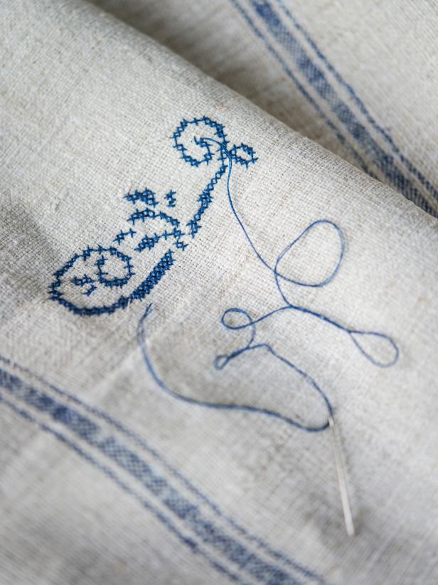 Step 4: Knot Thread in BackOnce thread is too small to work with, double knot it on backside of linen towel and trim. Use a new piece of two-ply floss and continue working on pattern until it is complete.