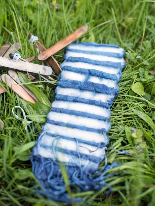 Step 4: Undo ResistsRemove resists (rubber bands, popsicle sticks, etc.) from scarf. Unfold fabric and hang or lay out to dry. Some of the fabric may again appear green until it is exposed to the air.