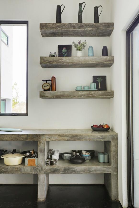 Gray Stone Kitchen Countertop and Shelf Structure With Matching Floating Shelves Over White Wall Gray Stone Kitchen Countertop and Shelf Structure With Matching Floating Shelves Over White Wall