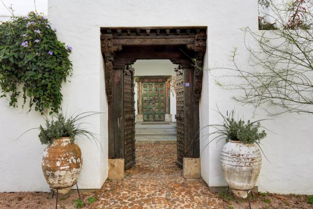 Asian Front Entryway With Elaborate Door Frame, Cobblestone Walkway and Large, Distressed Vases Asian Front Entryway With Elaborate Door Frame, Cobblestone Walkway and Large, Distressed Vases