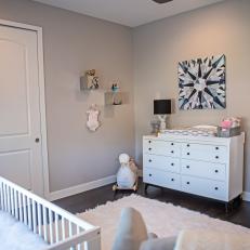 Sophisticated Gray And White Nursery With White Changing Table