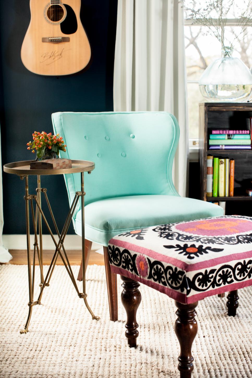 Blue Chair and Pink and Black Ottomans Create a Warm and Inviting Feel Warm and Inviting Writing Room with Vintage and Antique Furniture