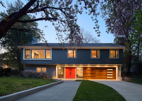 Midcentury Modern Exterior With Blue Siding and Red Front Doors