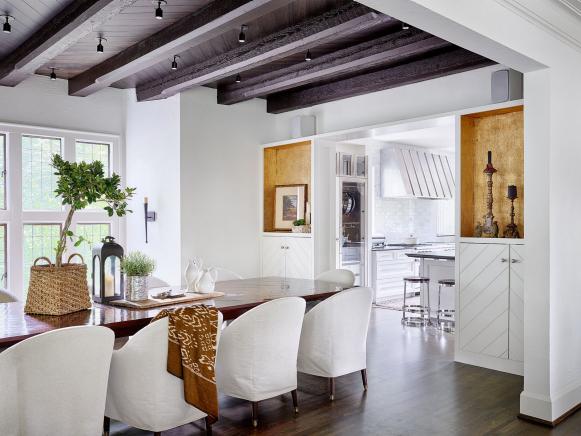 White Transitional Dining Room With Dark Wood Beam Ceiling