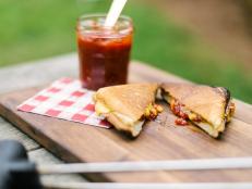 Half calzone, half grilled cheese, this easy campfire recipe is all delicious. 