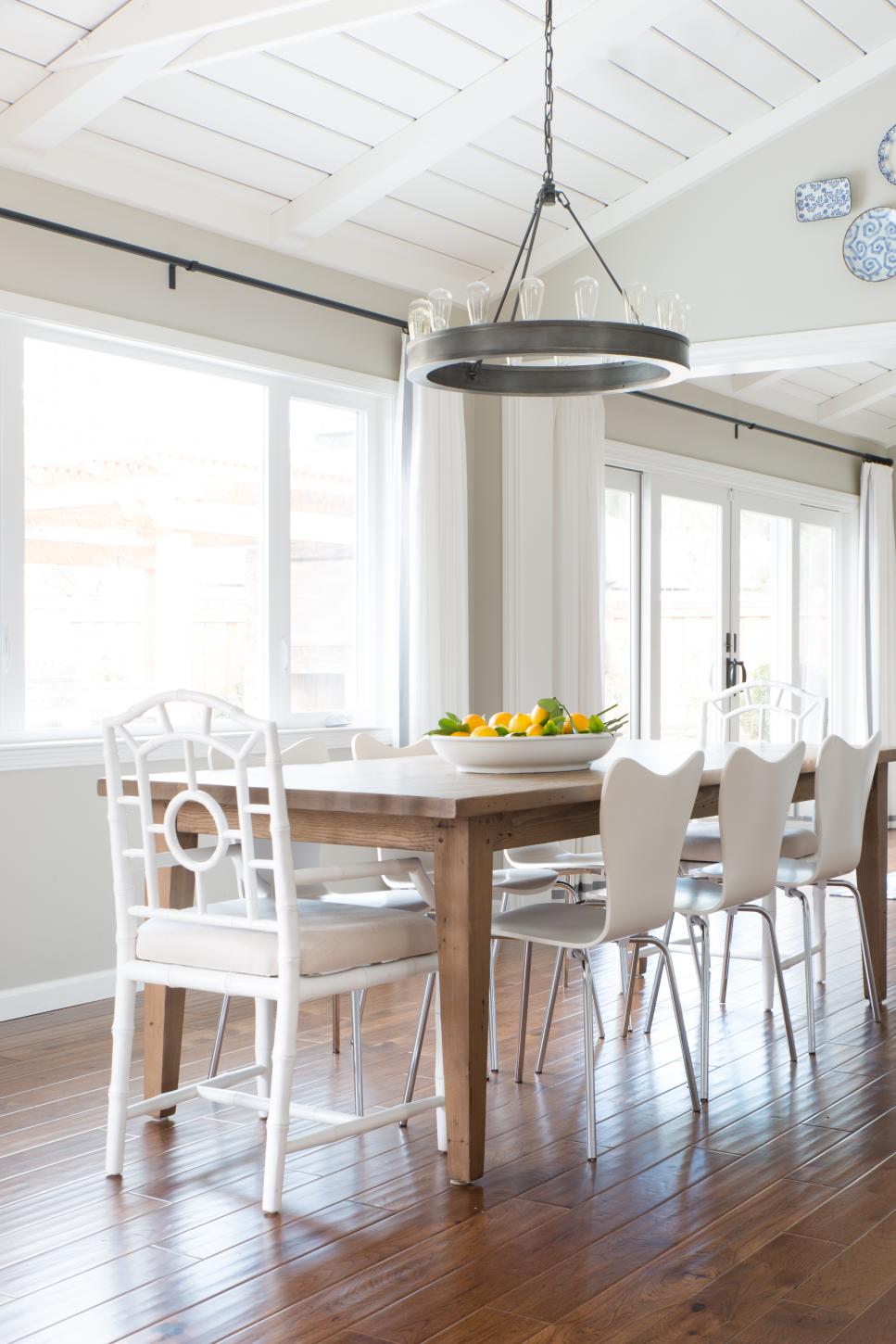 Light and Bright Transitional Dining Room With Industrial Chandelier White Dining Room With Rectangular Table and Circular Chandelier