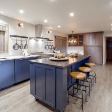 Fresh Kitchen Remodel With Blue Cabinets and Wide Plank Hardwood Floors